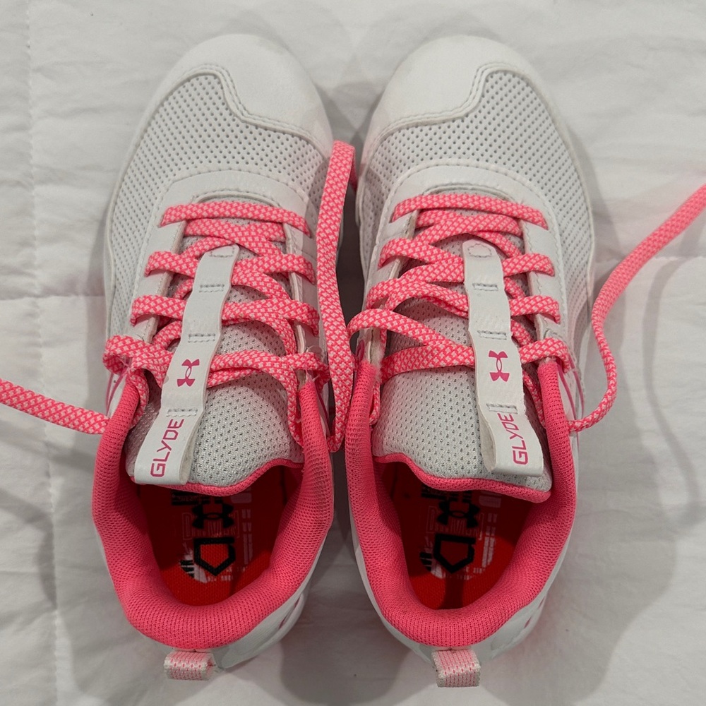 Under Armour girl’s softball cleats  in White and Pink size 1.5